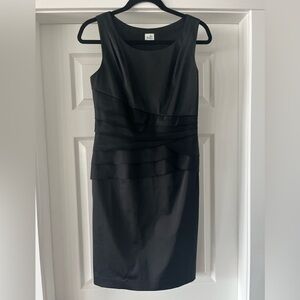 Beautiful fitted black satin LBD with flattering ruffle detail. US size 6.